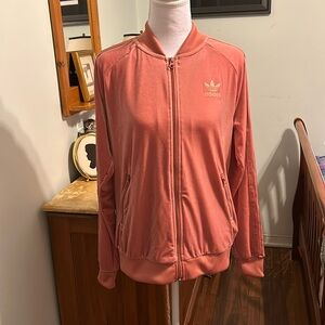 NWOT Adidas peach velour track jacket w/pockets. Three ribbon stripes on sleeves